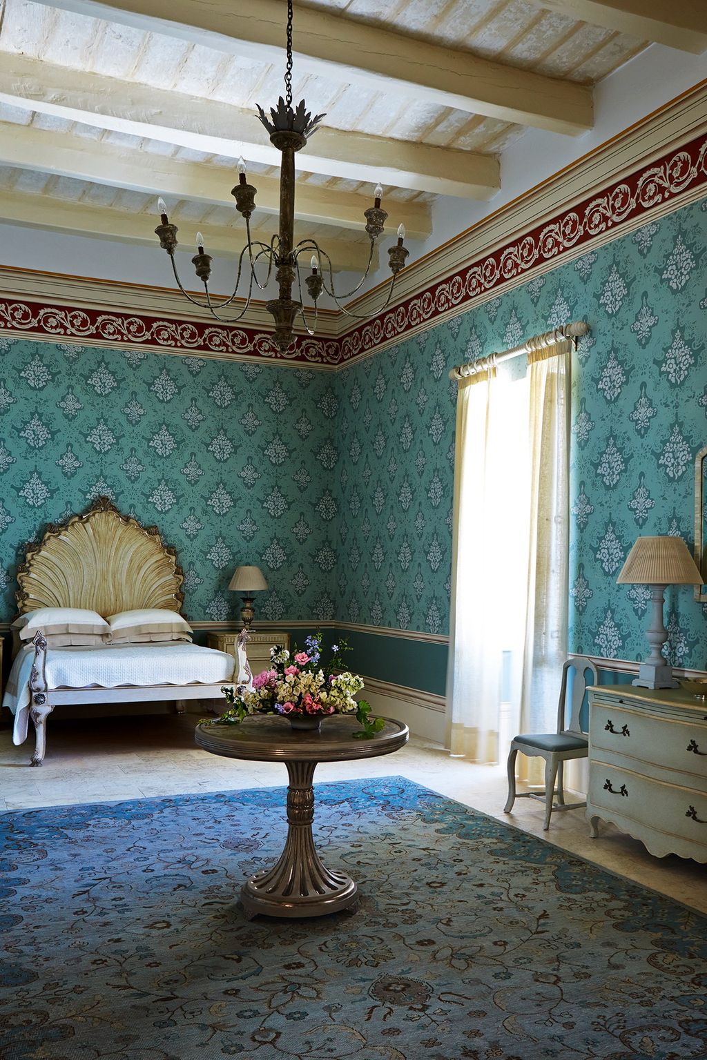 Image may contain Furniture Living Room Room Indoors Interior Design Table Couch Flooring and Coffee Table