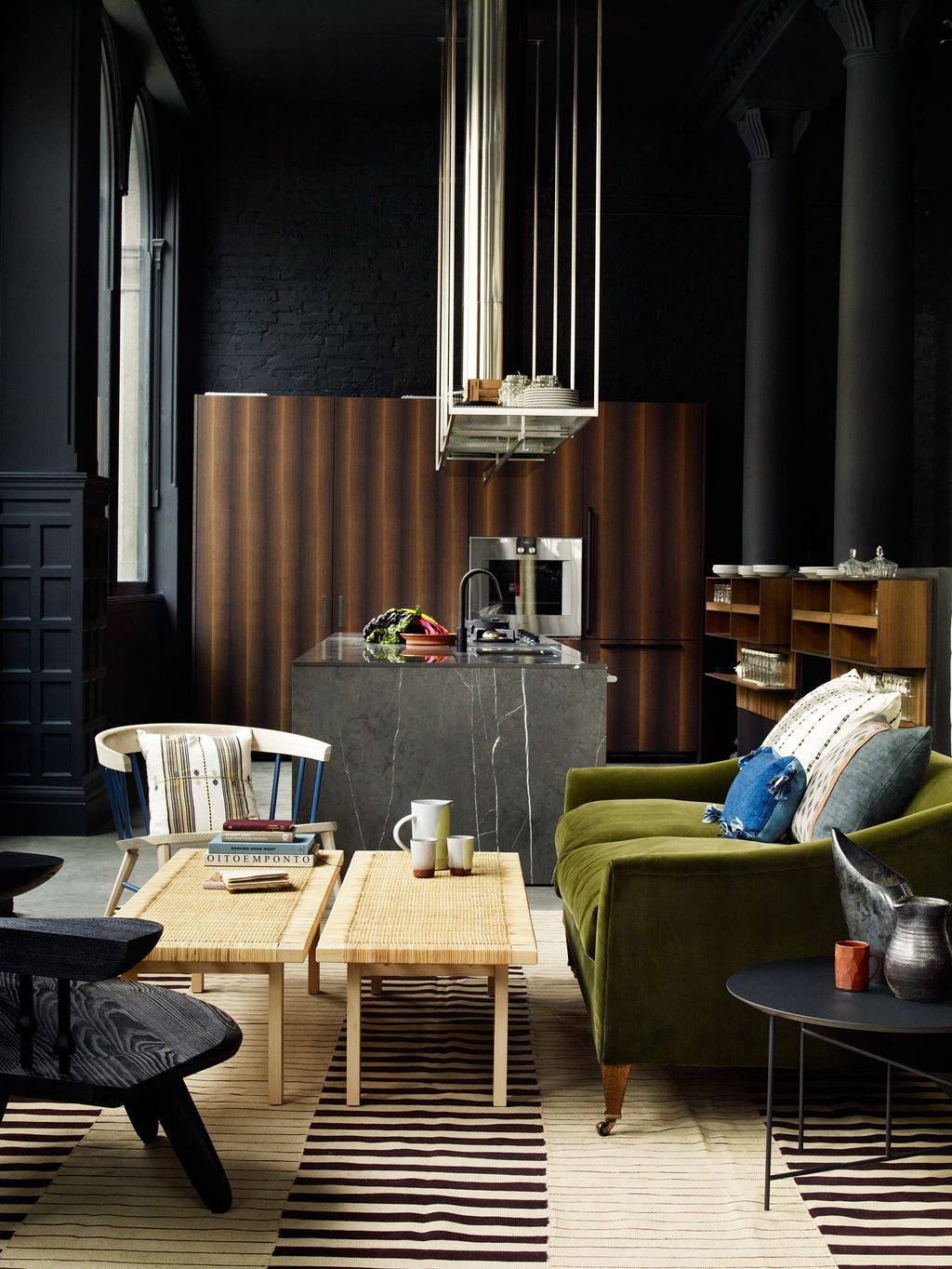 Image may contain Furniture Living Room Room Indoors Couch Chair Table Wood Interior Design and Coffee Table