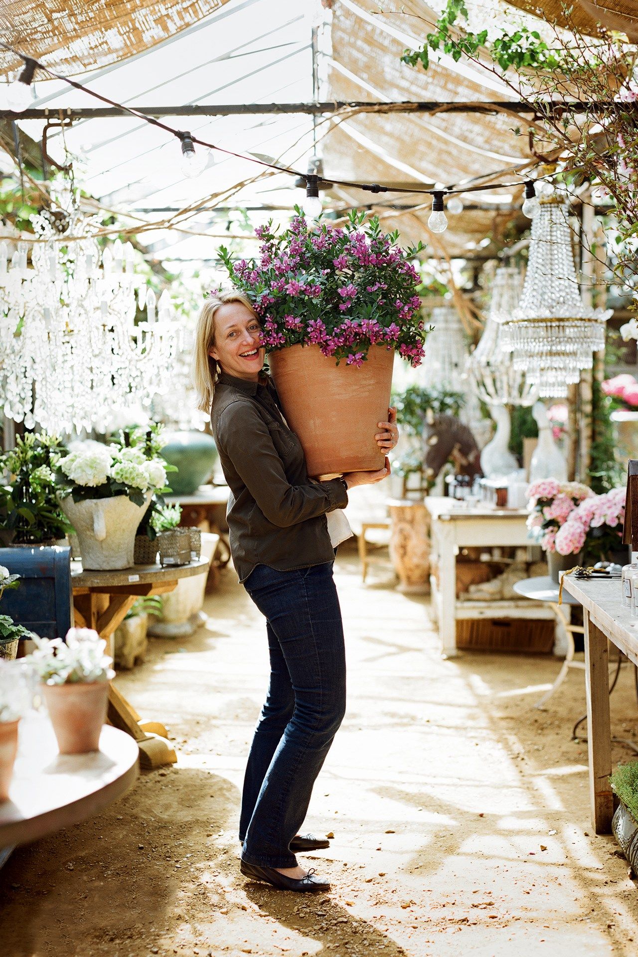 Image may contain Human Person Plant Clothing Apparel Footwear Shoe Flower Blossom Flower Arrangement and Garden