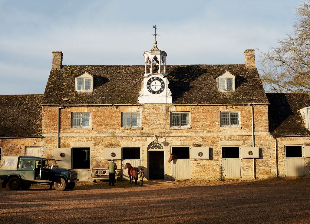 Image may contain Architecture Tower Building Human Person Clock Tower Vehicle Transportation Truck and Spire