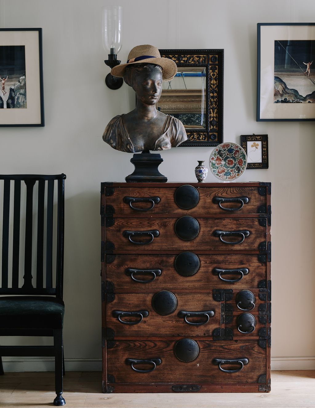 Image may contain Furniture Hat Clothing Apparel Chair Cabinet Hardwood and Wood