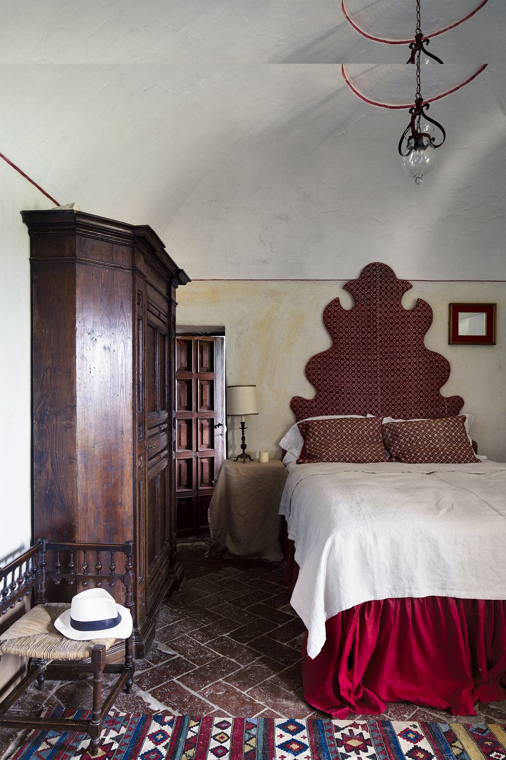 The house has 10 bedrooms Holly covered the headboard in this one using a local red and white woven wool blanket.