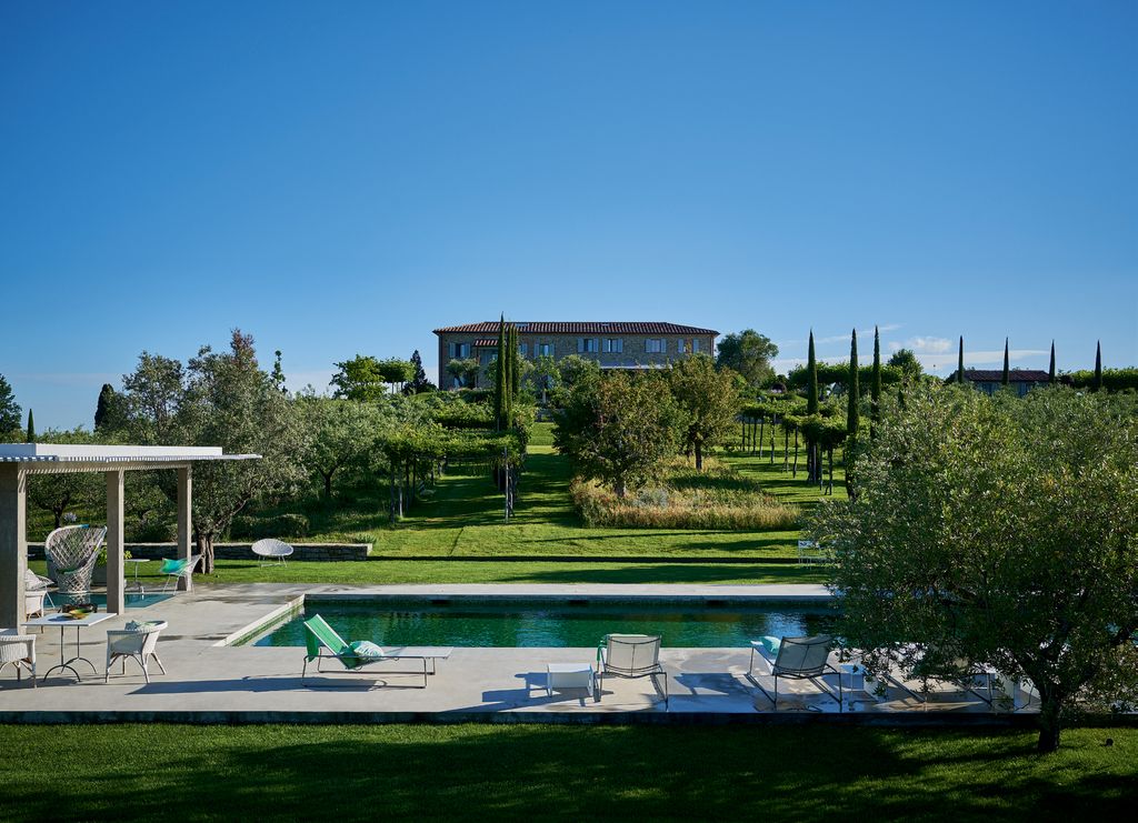 Image may contain Grass Plant Hotel Building Resort and Outdoors