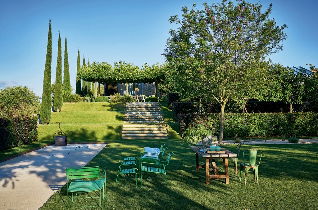 Image may contain Grass Plant Lawn Outdoors Furniture Yard Nature Patio Park Chair and Table