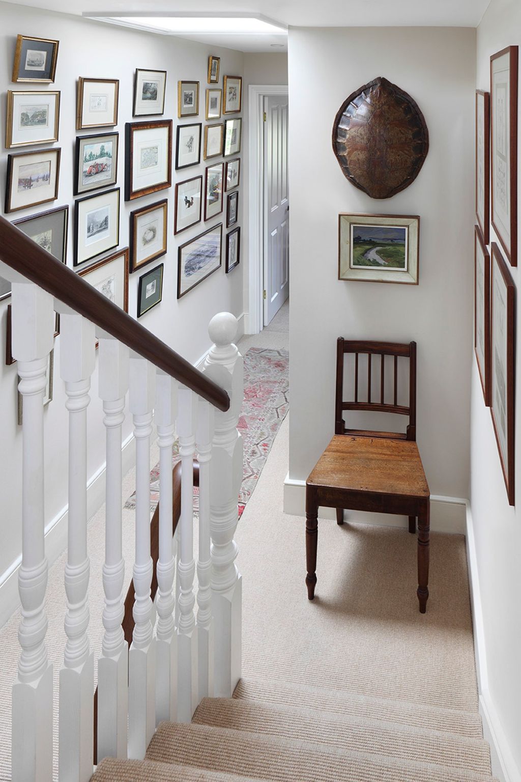 Image may contain Banister Handrail Wood Flooring Interior Design Indoors Railing Hardwood Floor and Staircase