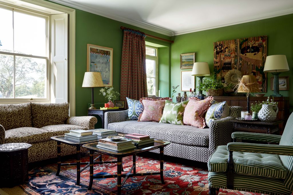 Image may contain Furniture Couch Living Room Room Indoors Table Home Decor Coffee Table and Rug