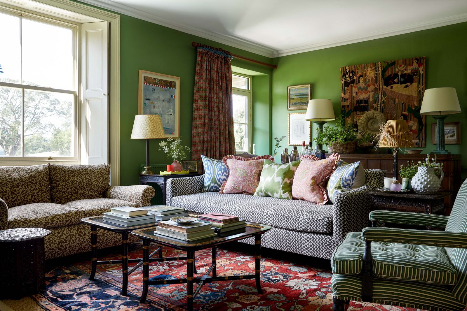 Image may contain Furniture Couch Living Room Room Indoors Table Home Decor Coffee Table and Rug