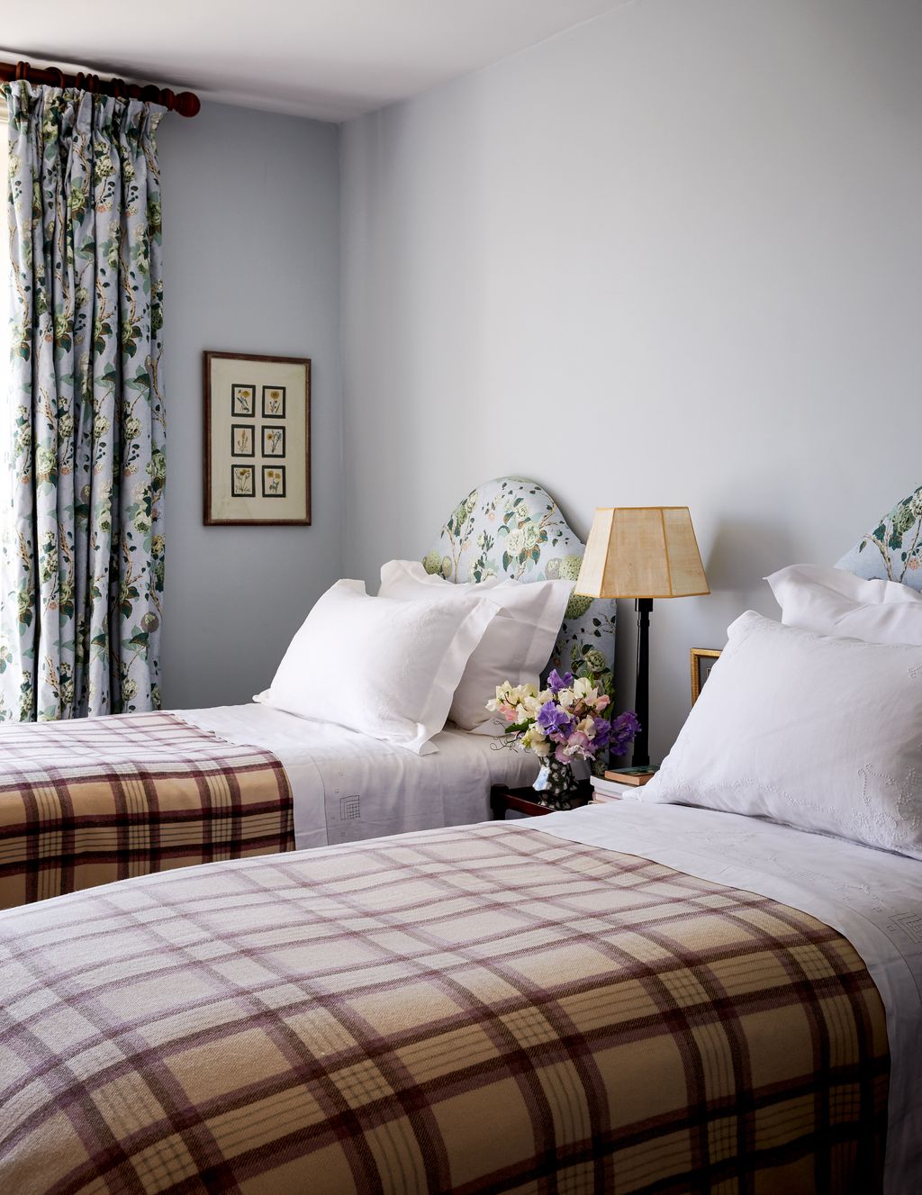 Image may contain Room Bedroom Indoors Furniture Bed Interior Design Living Room Plant Flower and Blossom