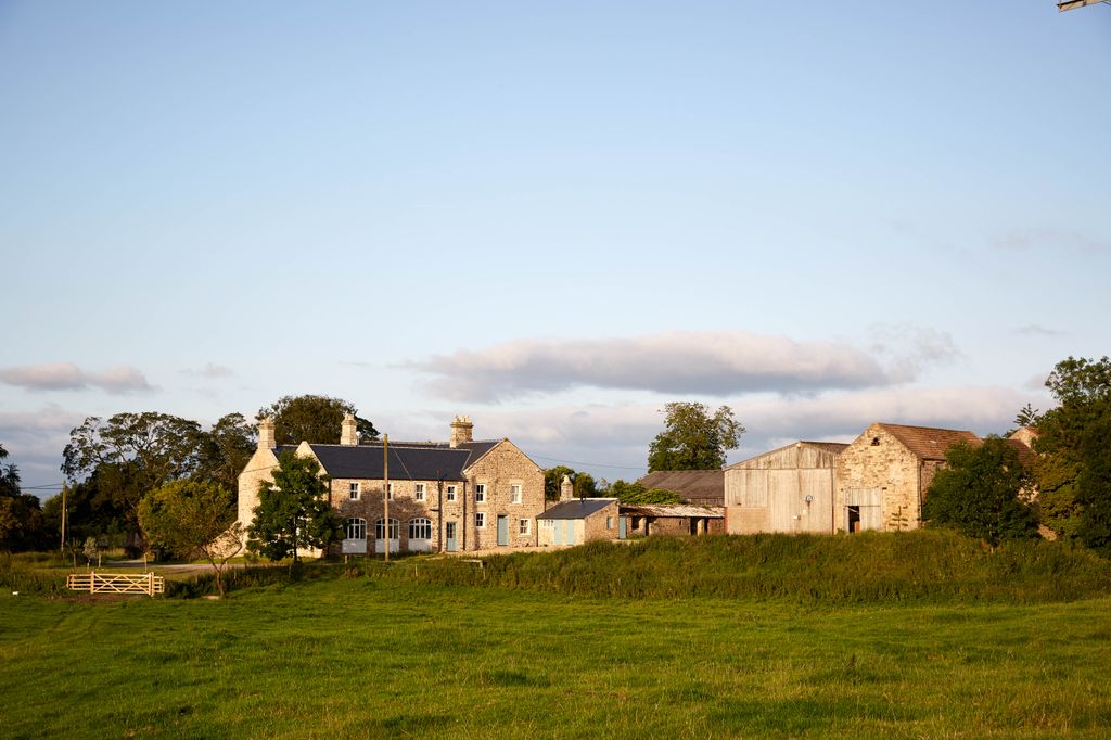 Image may contain Nature Outdoors Grass Plant Countryside Building Rural Grassland and Field