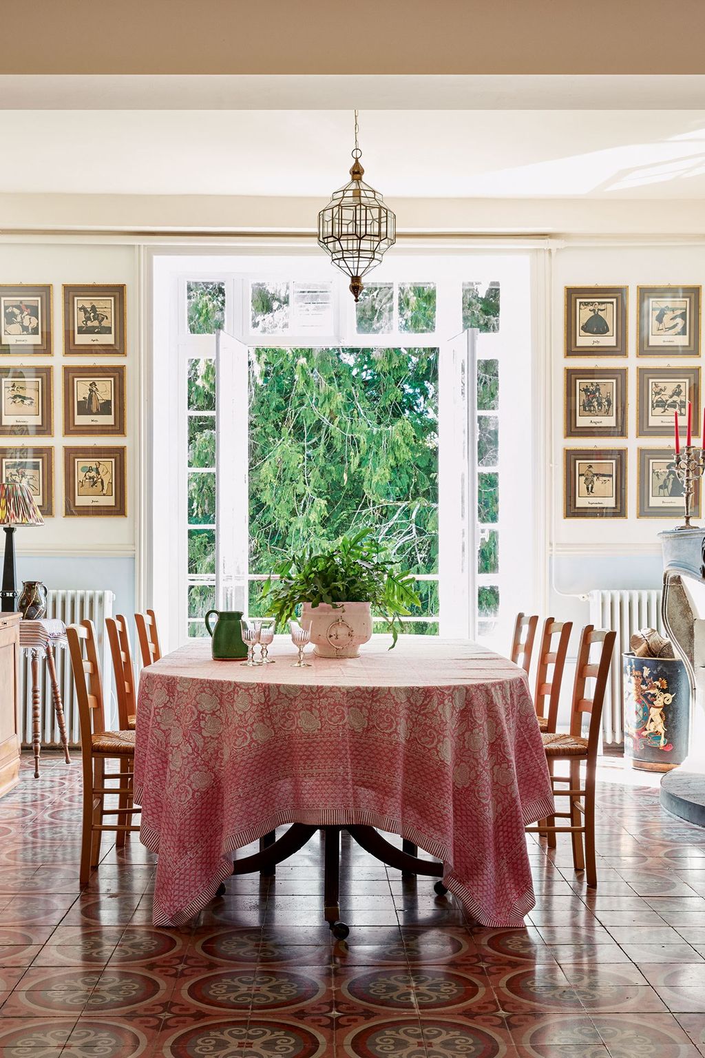 Image may contain Indoors Room Dining Room Furniture Chair Interior Design Table and Dining Table