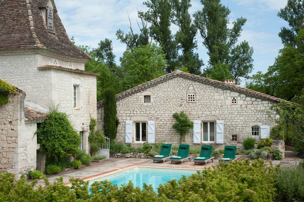 Image may contain Villa House Building Housing Cottage and Water