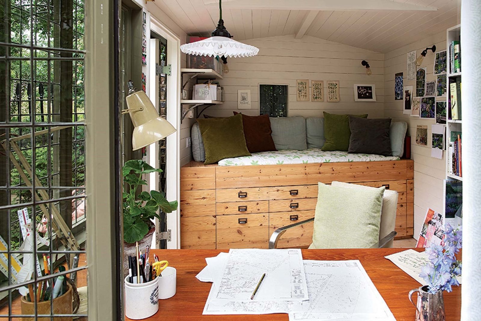 Image may contain Room Bedroom Indoors Furniture Cushion Pillow Dorm Room Interior Design Table and Living Room