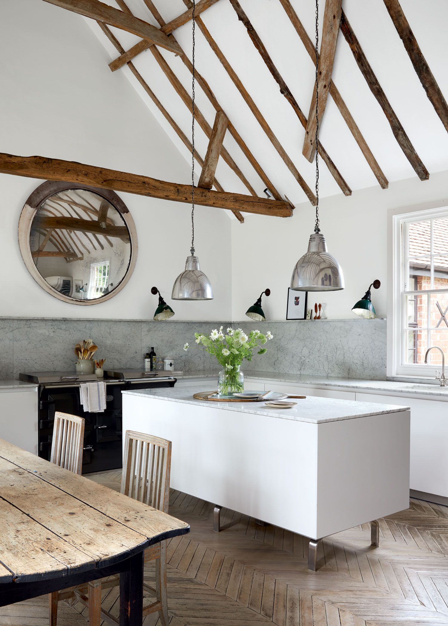 Vintage wall lights from Retrouvius and pendants from Hector Finch complement a convex mirror from Ardingly Antiques...