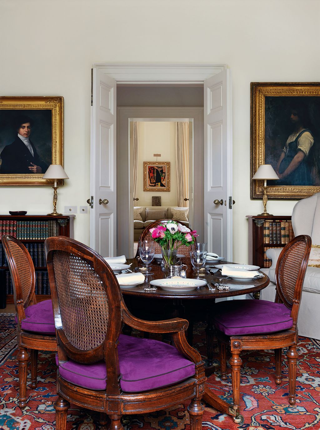 Image may contain Furniture Chair Room Indoors Human Person Living Room Flooring Dining Room and Interior Design