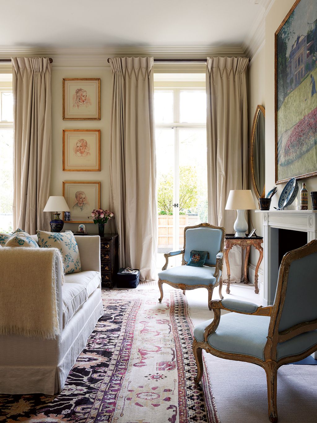 Image may contain Living Room Indoors Room Furniture Chair Couch Rug and Interior Design