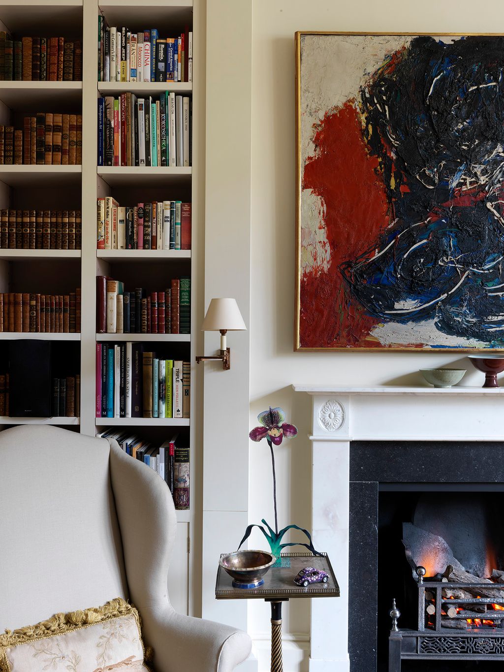 Image may contain Furniture Bookcase Shelf Interior Design Indoors Living Room and Room