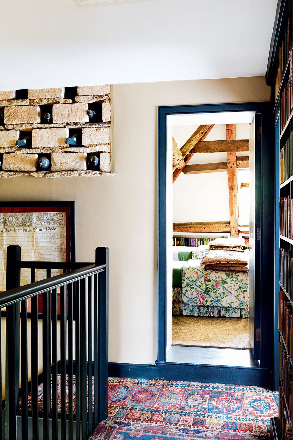 Image may contain Banister Handrail Railing Interior Design Indoors Shelf Room and Rug