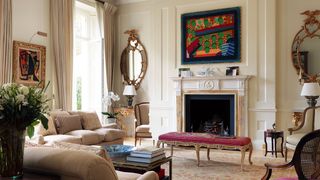 Image may contain Living Room Room Indoors Furniture Chair Interior Design Couch Fireplace and Table