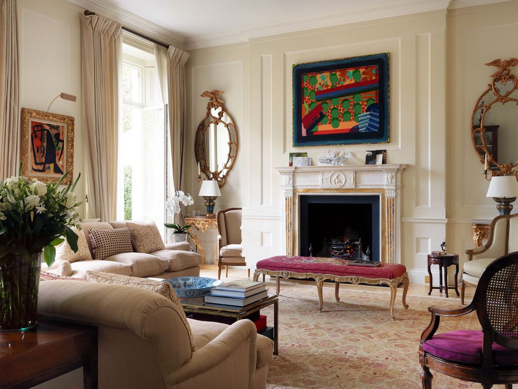 Image may contain Living Room Room Indoors Furniture Chair Interior Design Couch Fireplace and Table