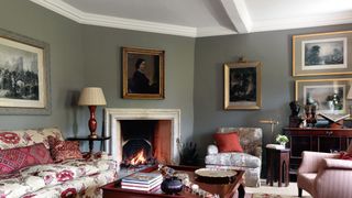 Image may contain Living Room Room Indoors Furniture Fireplace Interior Design Couch Table and Hearth