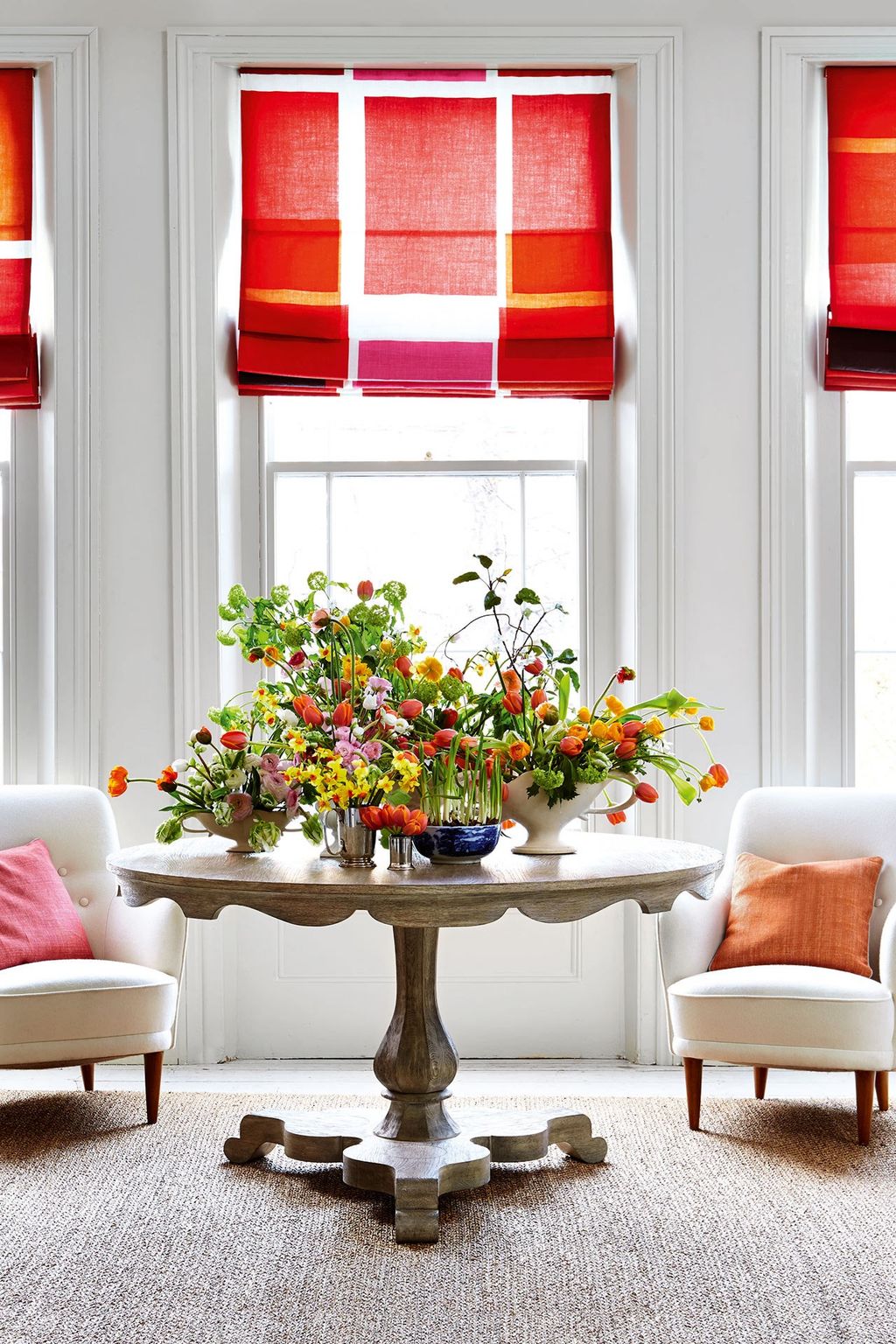 Image may contain Home Decor Furniture Living Room Indoors Room Plant Table Flower Blossom and Cushion