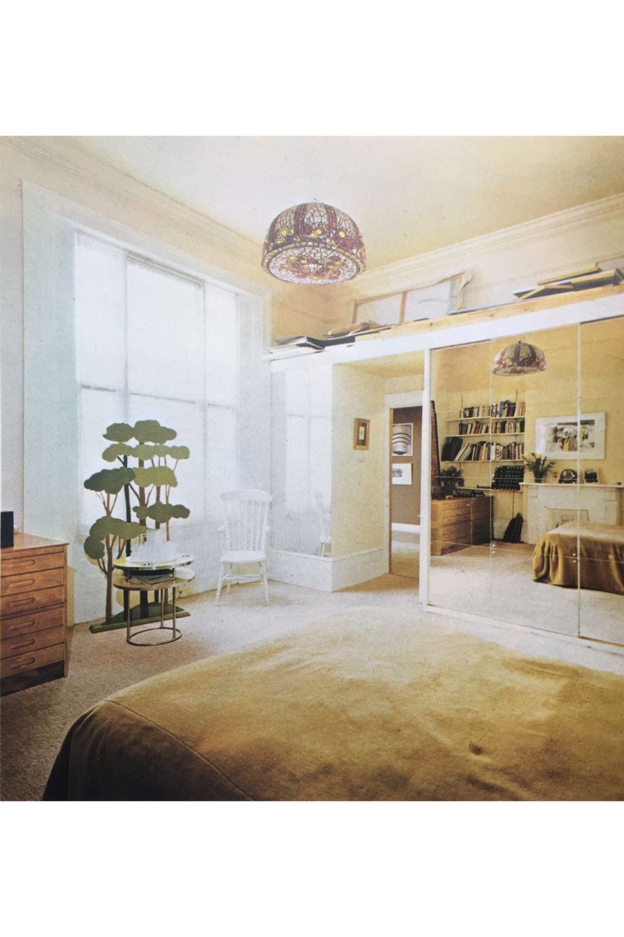 Image may contain Furniture Chair Interior Design Indoors Flooring Floor Living Room Room Rug and Wood