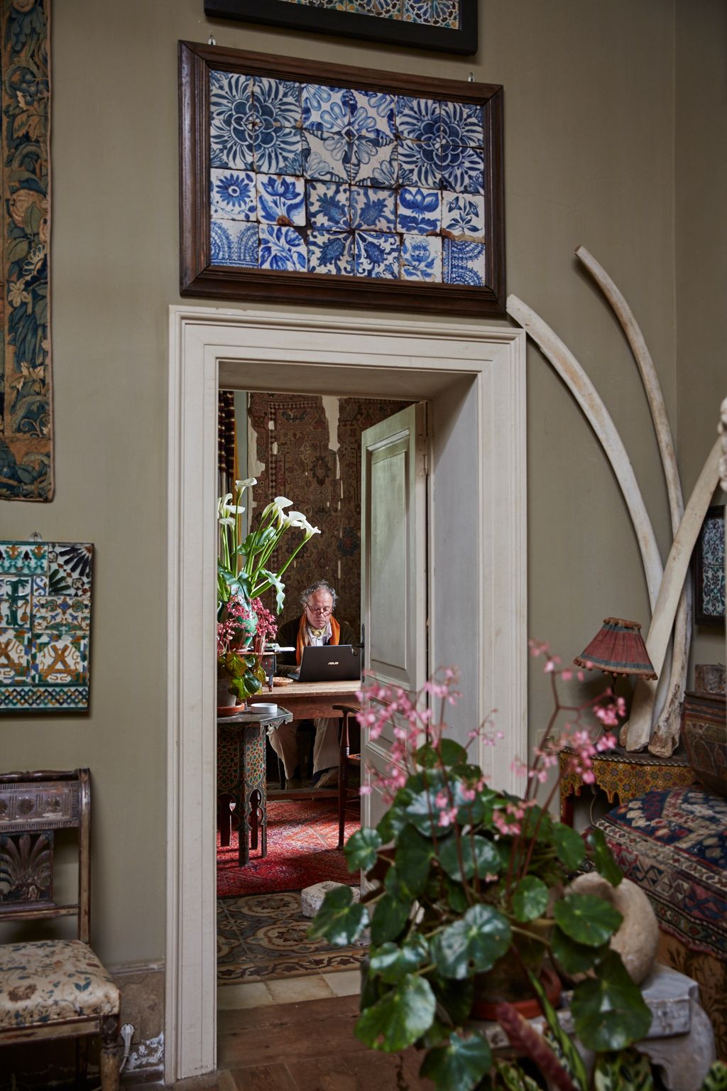 Image may contain Indoors Interior Design Flooring Human Person Plant Living Room Room Furniture Couch and Flower