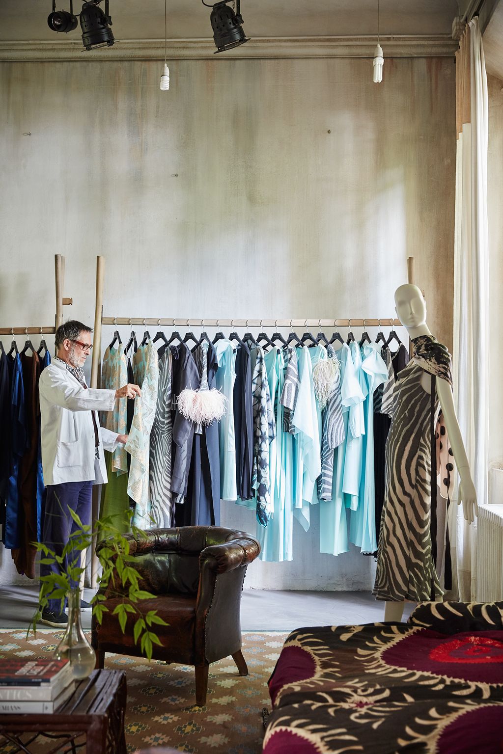 Image may contain Human Person Furniture Boutique Shop Indoors Room and Chair