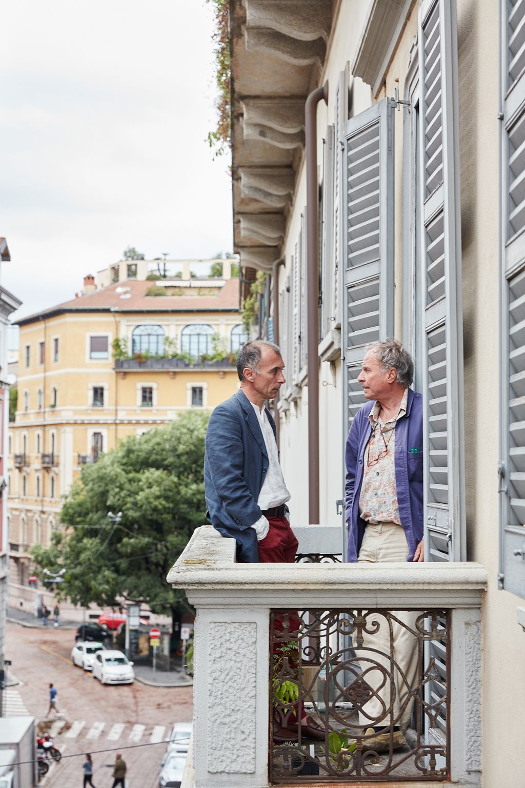 Image may contain Home Decor Human Person Curtain Shutter Window Clothing Apparel and Railing