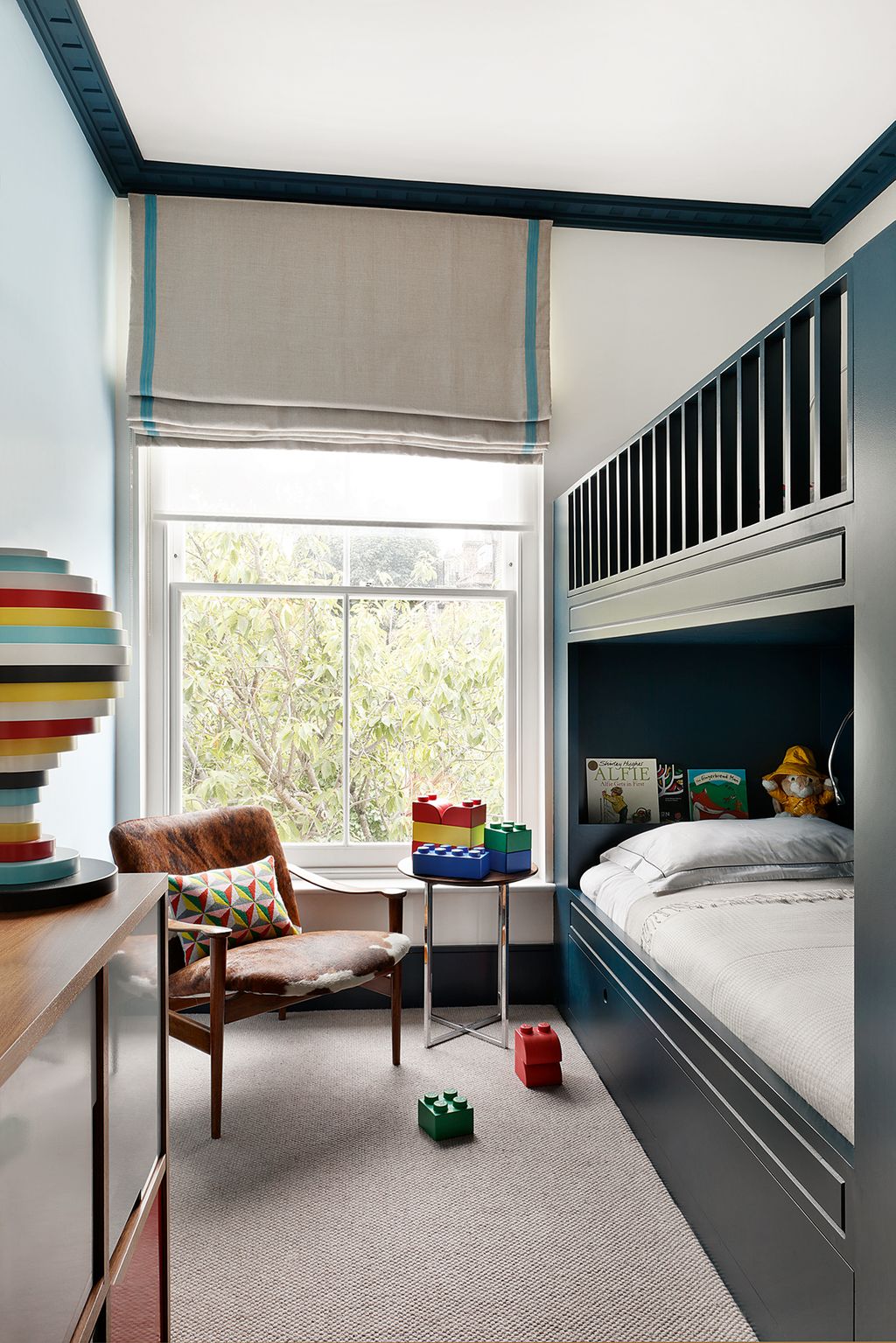 In the youngest child's bedroom the woodwork is painted in Farrow  Ball's 'Hague Blue'.