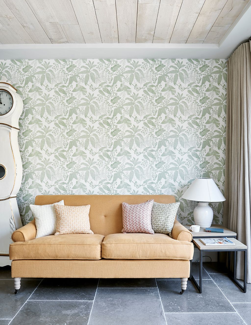 Image may contain Furniture Lamp Table Lamp Living Room Indoors Room and Couch