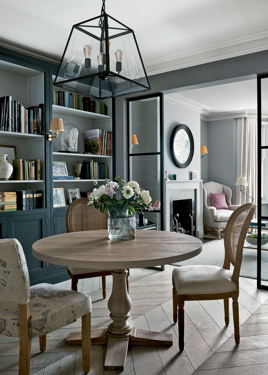 Image may contain Furniture Chair Indoors Interior Design Living Room Room Plant Table Shelf Flower and Blossom