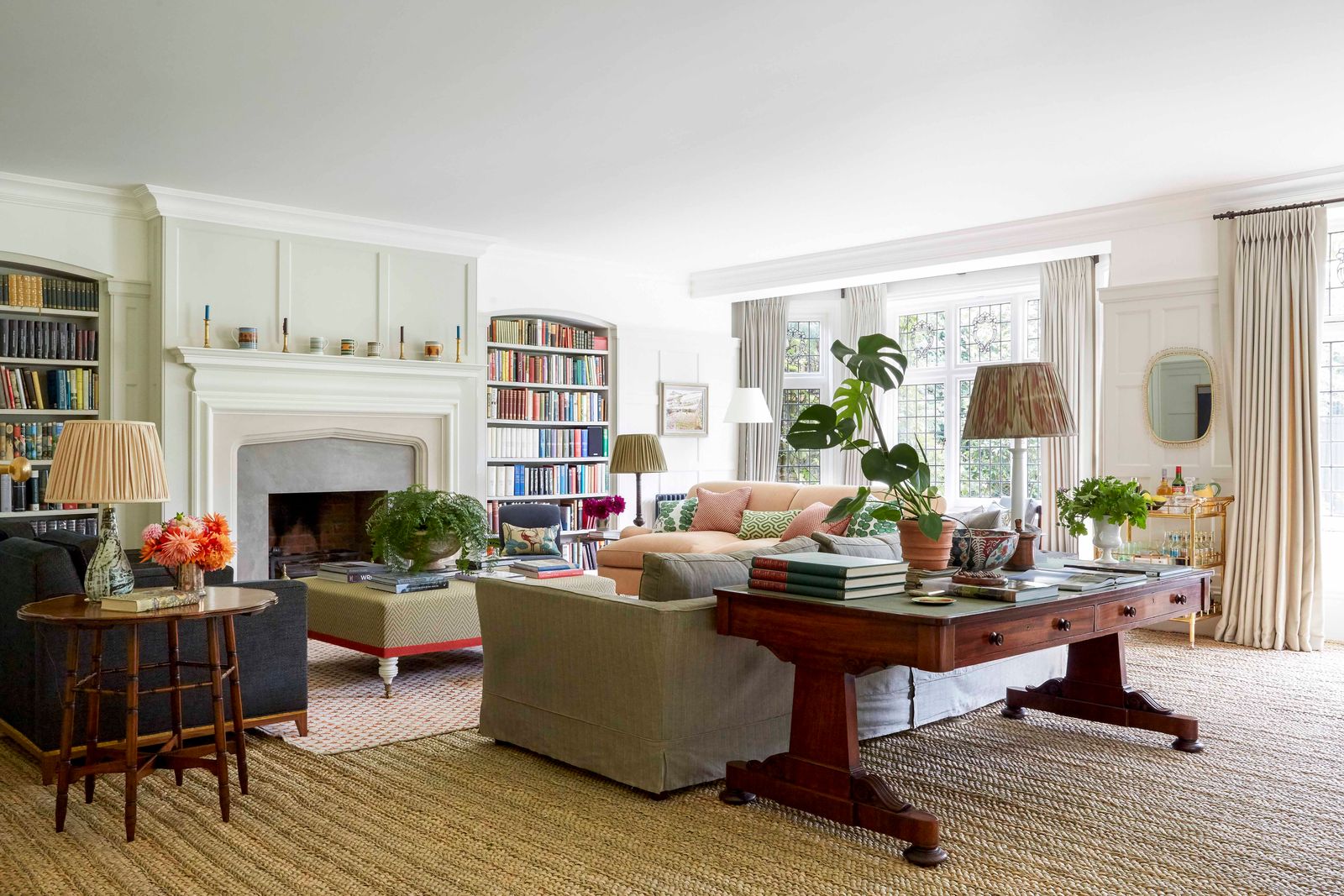 Image may contain Furniture Living Room Room Indoors Table Coffee Table Couch Flooring and Interior Design