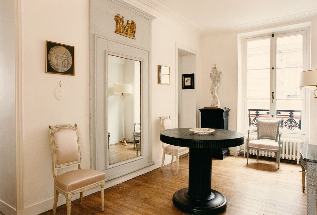 Image may contain Flooring Floor Wood Furniture Chair Hardwood Living Room Room Indoors and Interior Design