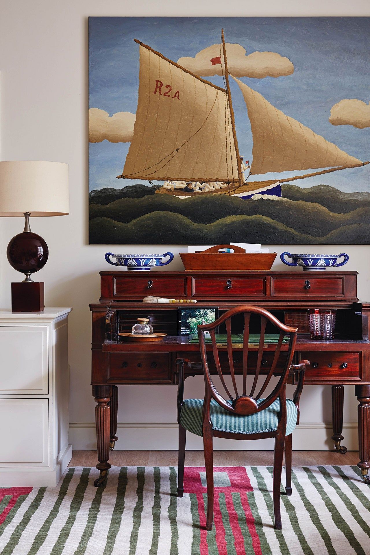 Image may contain Furniture Table Desk Screen Electronics Monitor Display Lcd Screen Chair Wood and Rug