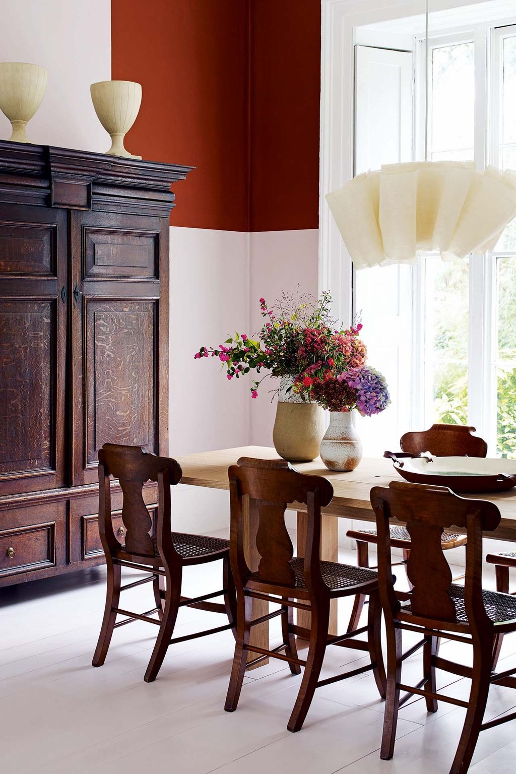 Image may contain Furniture Chair Room Indoors Dining Room Dining Table Table Interior Design and Wood