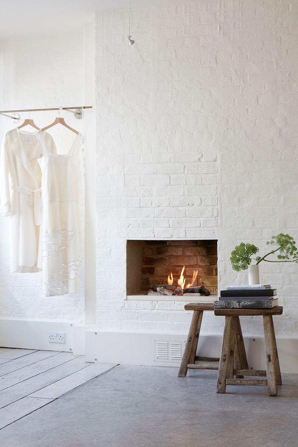 Image may contain Fireplace Indoors Hearth Plant and Tree