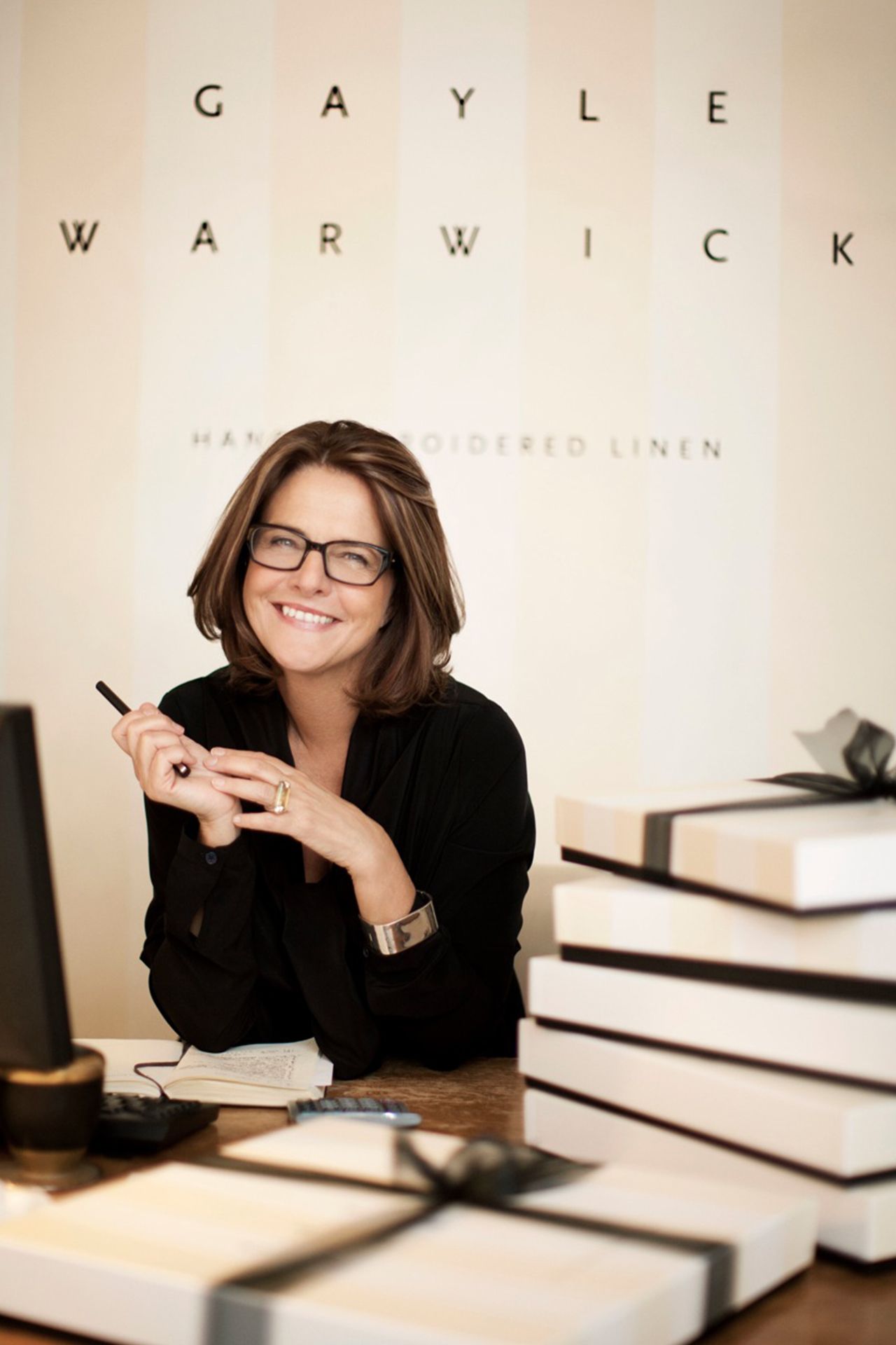 Image may contain Human Person Sitting Glasses Accessories Accessory Furniture Table Desk and Musical Instrument