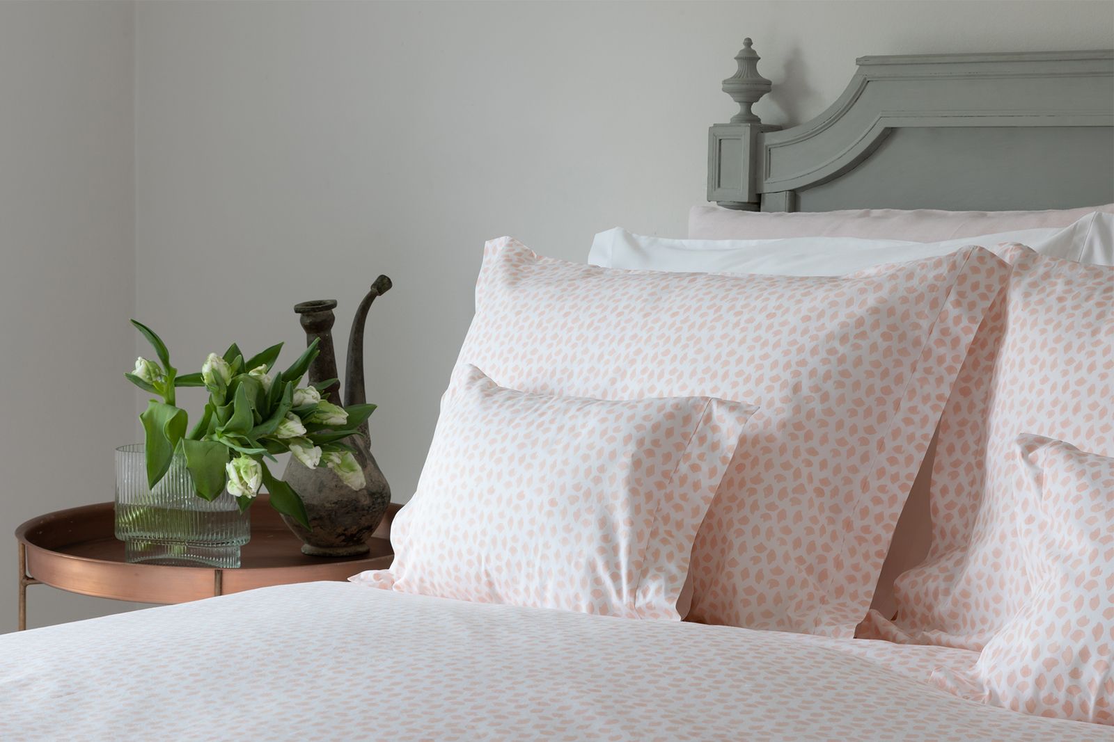 Image may contain Cushion Pillow Furniture Home Decor Linen and Bed