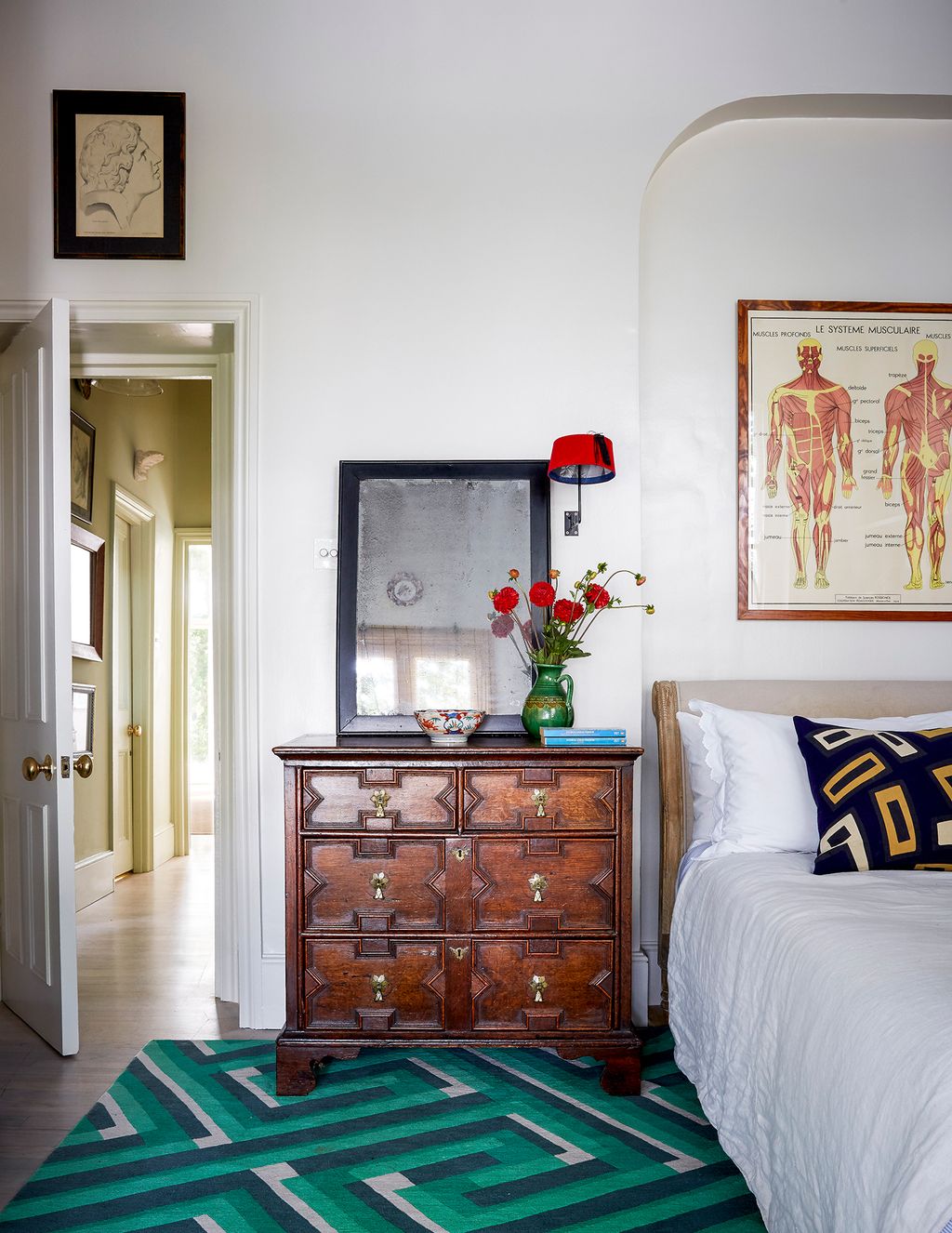 Image may contain Interior Design Indoors Furniture Rug Plant Room Bedroom Cabinet Flower and Blossom
