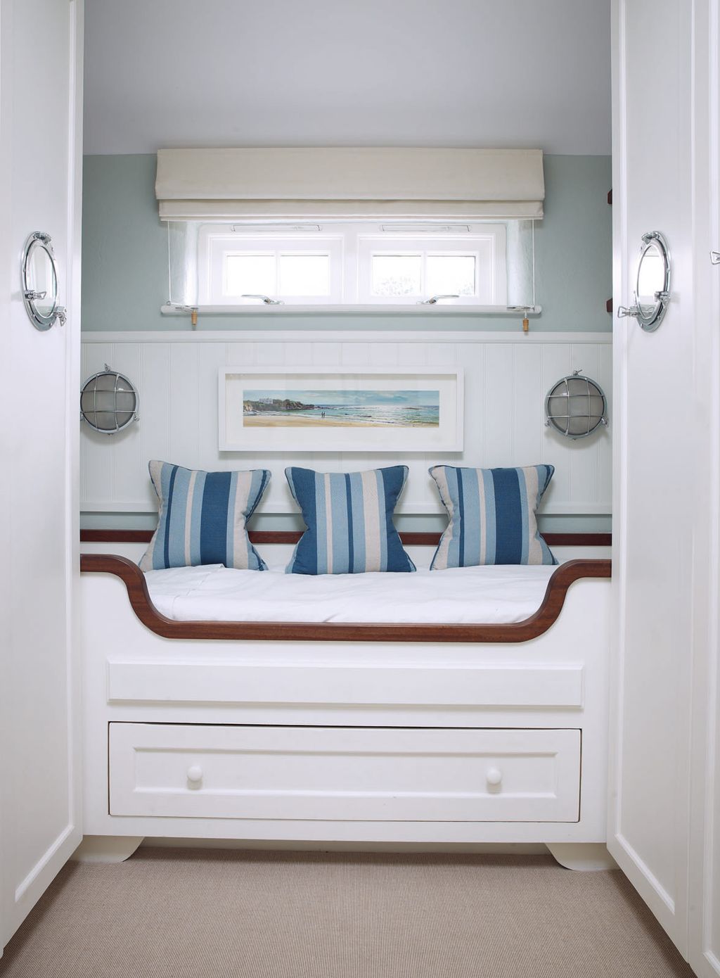 A cabinstyle berth makes the most of limited space in a spare room.