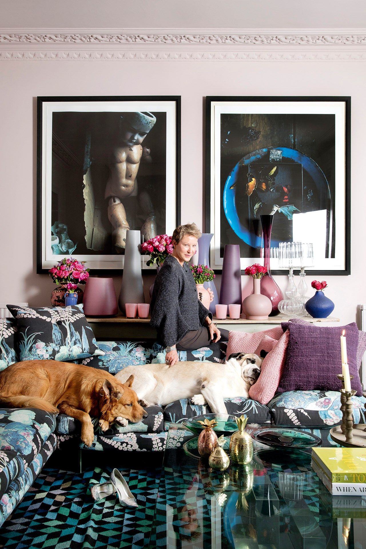 Image may contain Furniture Couch Human Person Animal Dog Mammal Pet Canine Living Room Room and Indoors