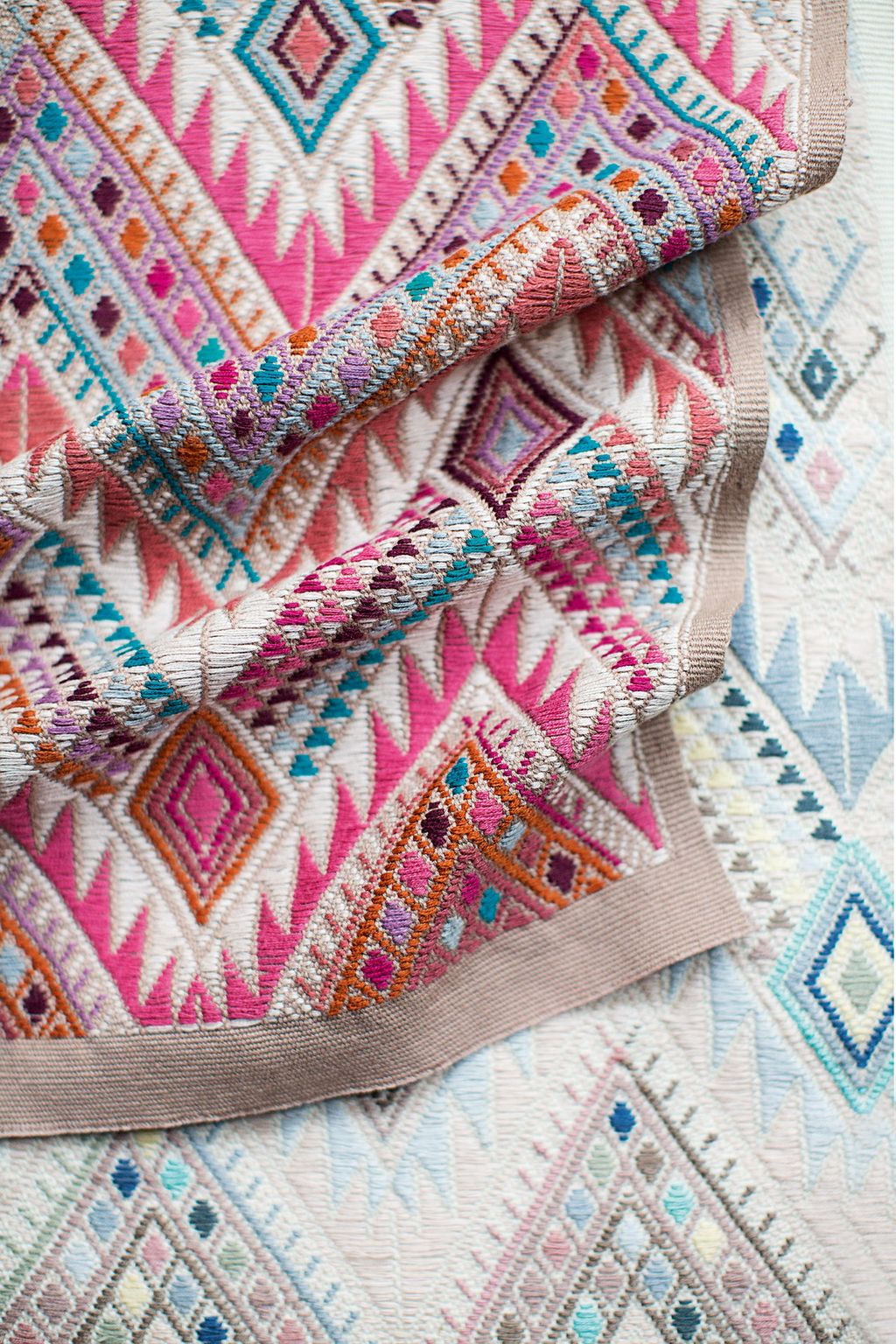 Image may contain Rug Pattern and Embroidery