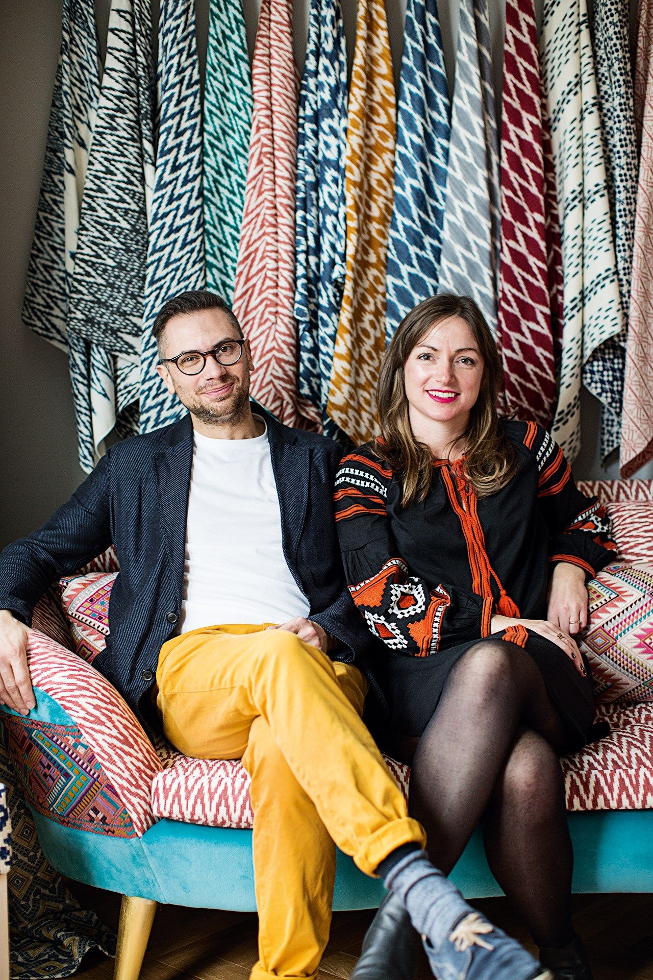 Image may contain Human Person Furniture Couch Sitting Clothing and Apparel