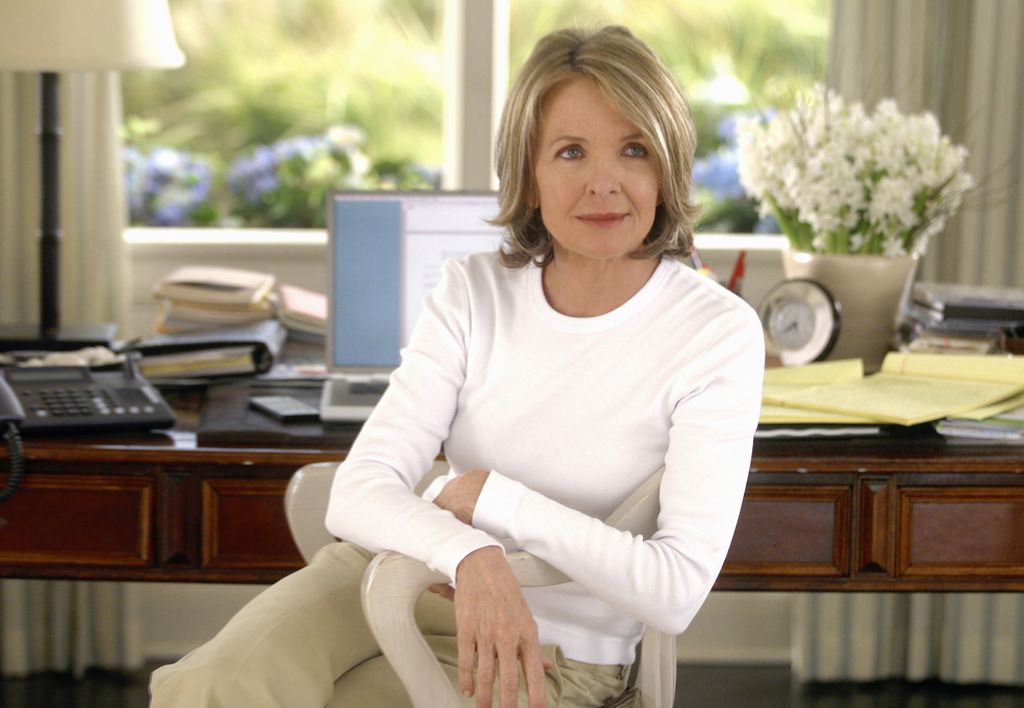 Image may contain Diane Keaton Furniture Human Person Table Clothing Apparel Computer Keyboard and Electronics