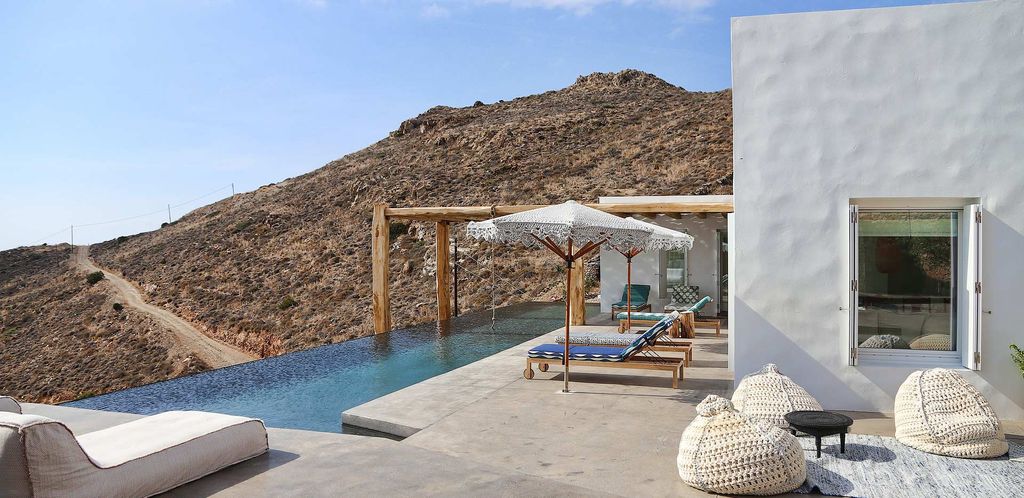 Image may contain Patio Building Porch Furniture Couch and Wood