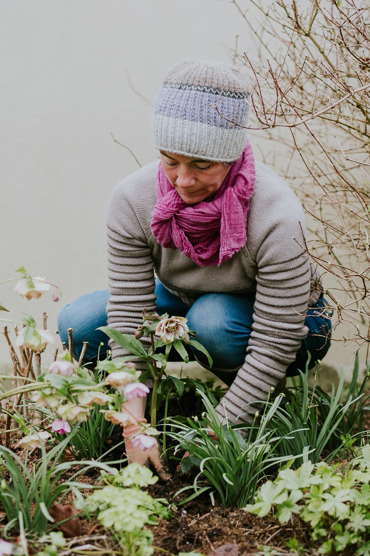 Image may contain Clothing Apparel Outdoors Garden Human Person and Scarf