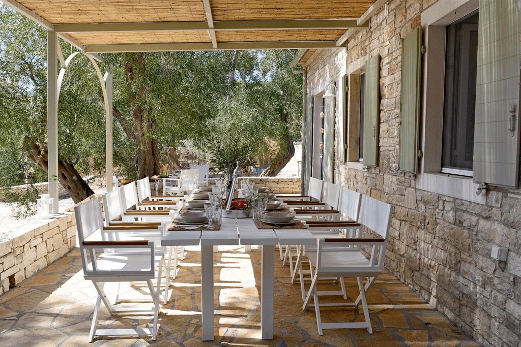 A pretty rusticstyle farmhouse with modern touches decorated with the yellows greens and blues of its surroundings on...