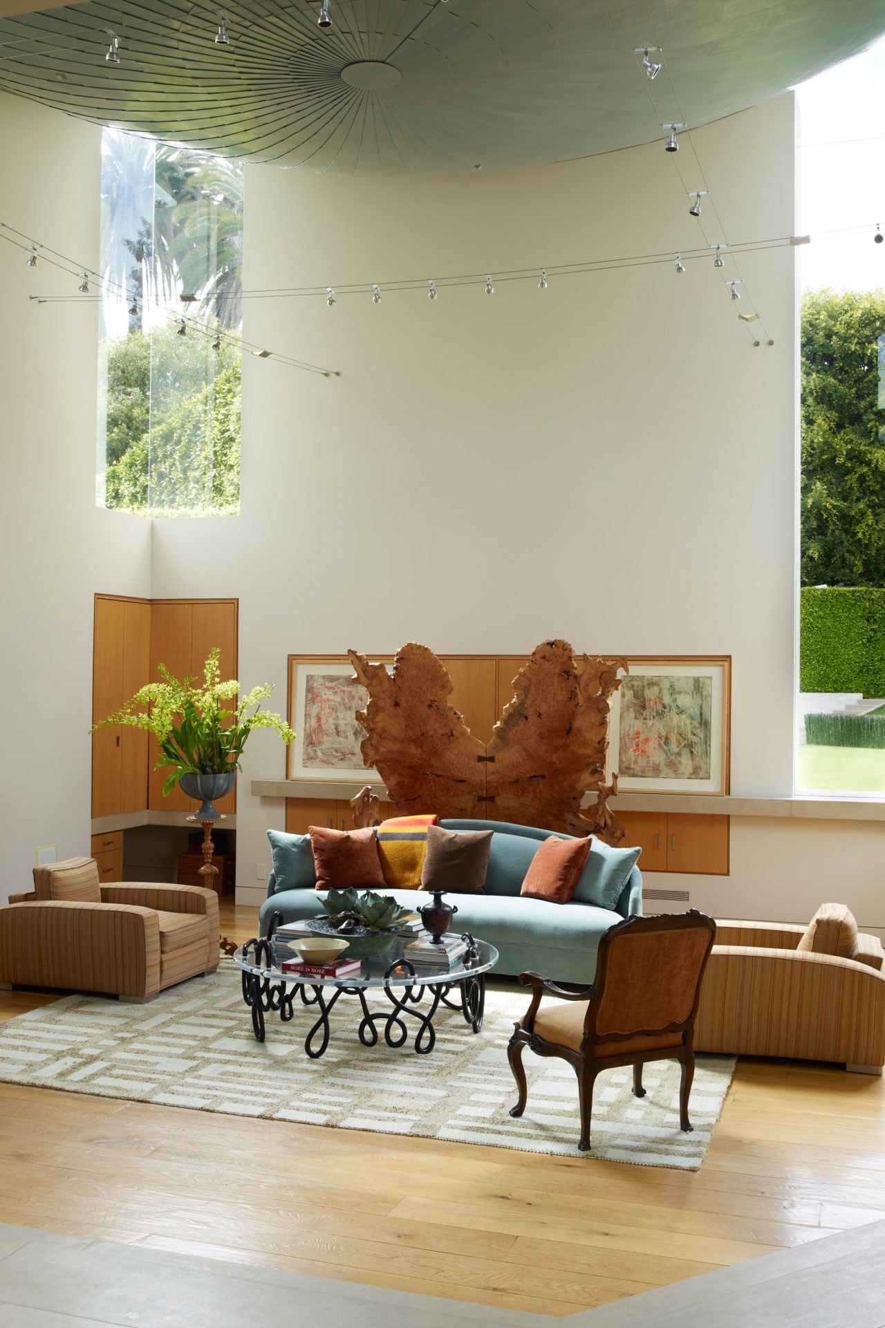 Image may contain Furniture Living Room Room Indoors Couch Chair Table Coffee Table Rug and Interior Design