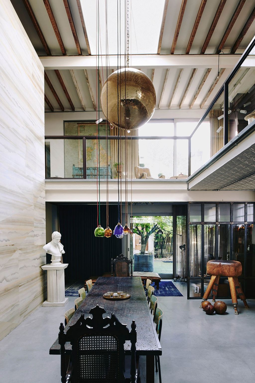 Image may contain Interior Design Indoors Housing Building Furniture Flooring Human Person Room and Living Room